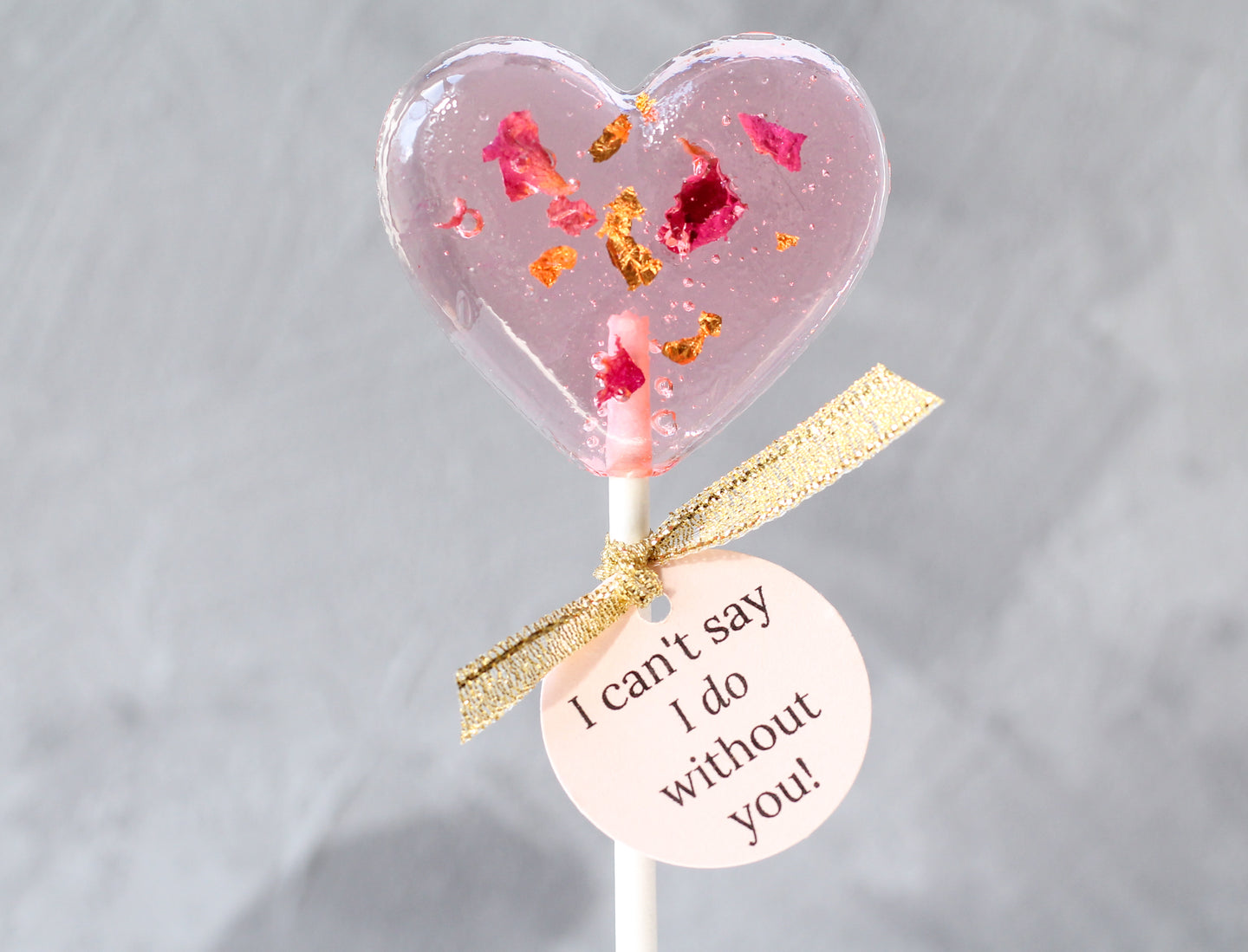 heart shaped lollipop with rose petals and 24 K gold leaf